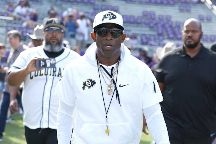Colorado Buffaloes head coach Deon Sanders walks on the field before the game against the TCU Horned Frogs at Amon G. Carter Stadium